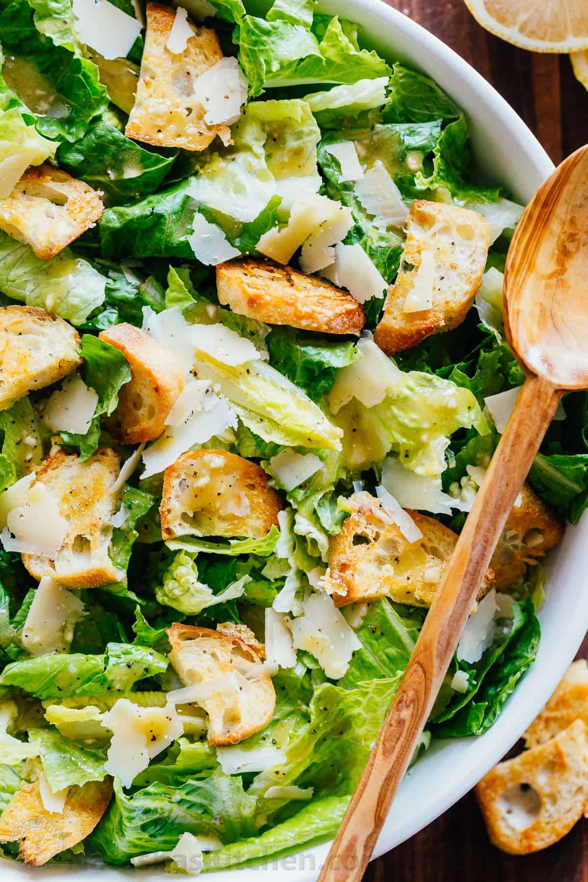 Caesar Salad with crisp homemade croutons and a light caesar dressing. This Classic Ceasar Salad Recipe will impress your dinner guests! #caesarsalad #caesarsaladrecipe #salad #saladrecipes #natashaskitchen #caesardressing #croutonsrecipe #homemadecroutons #howtomakecaesarsalad #easycaesarsalad #homemadecroutons #natashaskitchen Romain Salad with croutons, parmesan and caesar dressing
