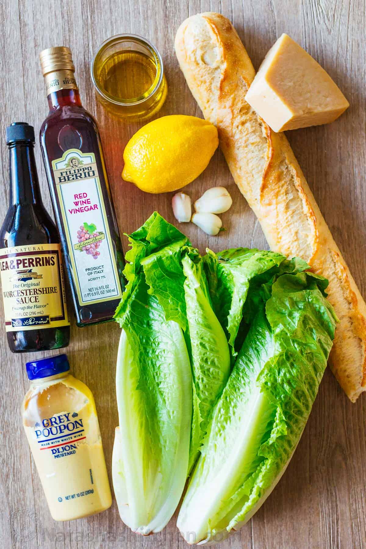 A classic Caesar Salad recipe with crisp romaine lettuce, fresh parmesan cheese, crunchy homemade croutons, and a light Caesar dressing. Ingredients for caesar salad with romaine lettuce, crouton ingredients, and caesar salad ingredients