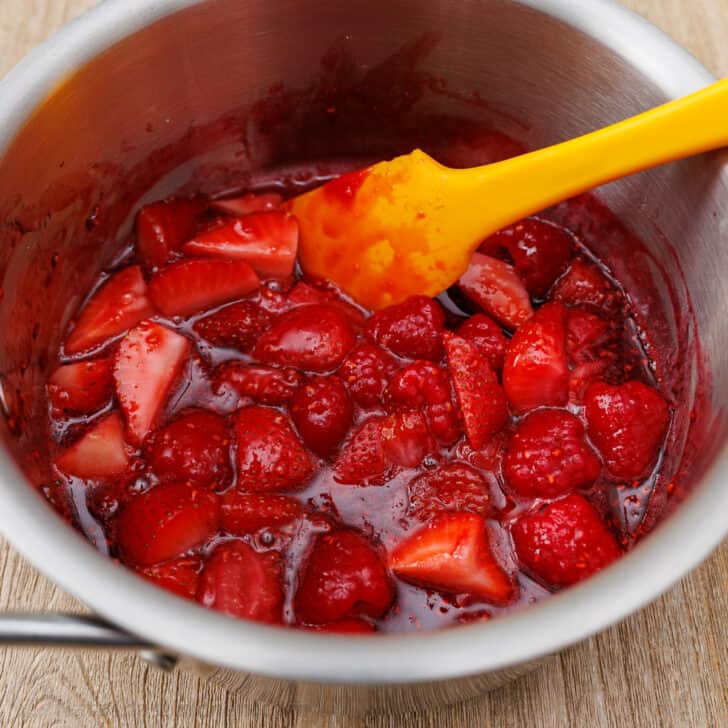 Panna Cotta is a quick and easy Italian dessert. The fresh berry sauce gives every creamy spoonful the perfect balance of sweet and tangy. Cooked syrupy berry sauce in saucepan
