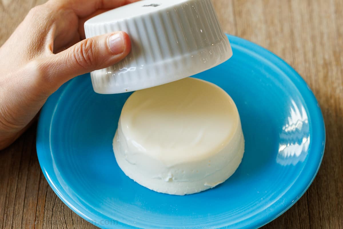 Panna Cotta is a quick and easy Italian dessert. The fresh berry sauce gives every creamy spoonful the perfect balance of sweet and tangy. How to turn out a Panna Cotta from the molding ramekin.