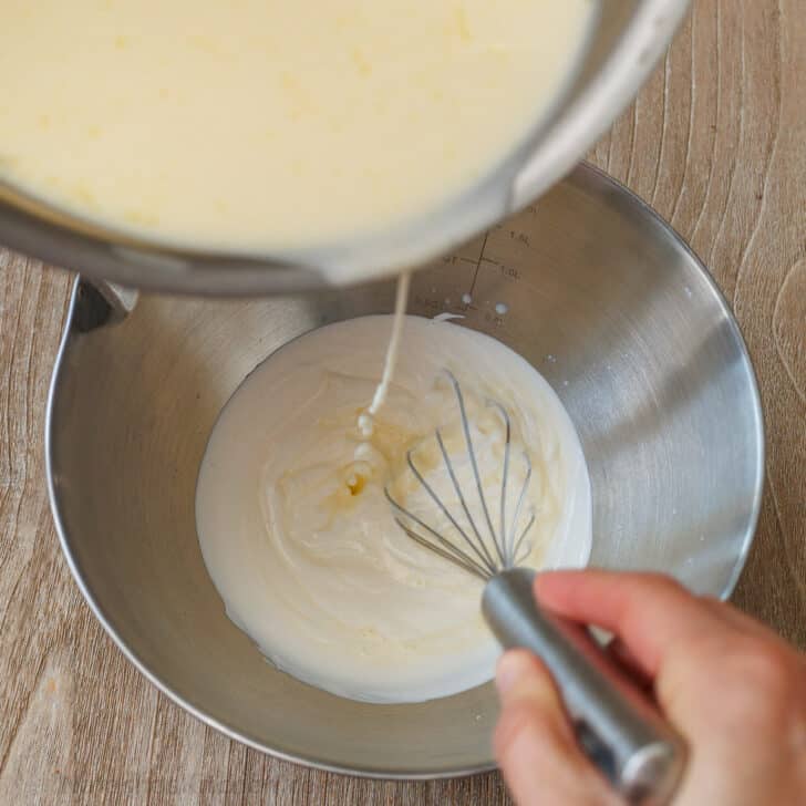 Panna Cotta is a quick and easy Italian dessert. The fresh berry sauce gives every creamy spoonful the perfect balance of sweet and tangy. Add sour cream to a bowl with pouring lip and add the gelatin and cream mixture while whisking constantly.