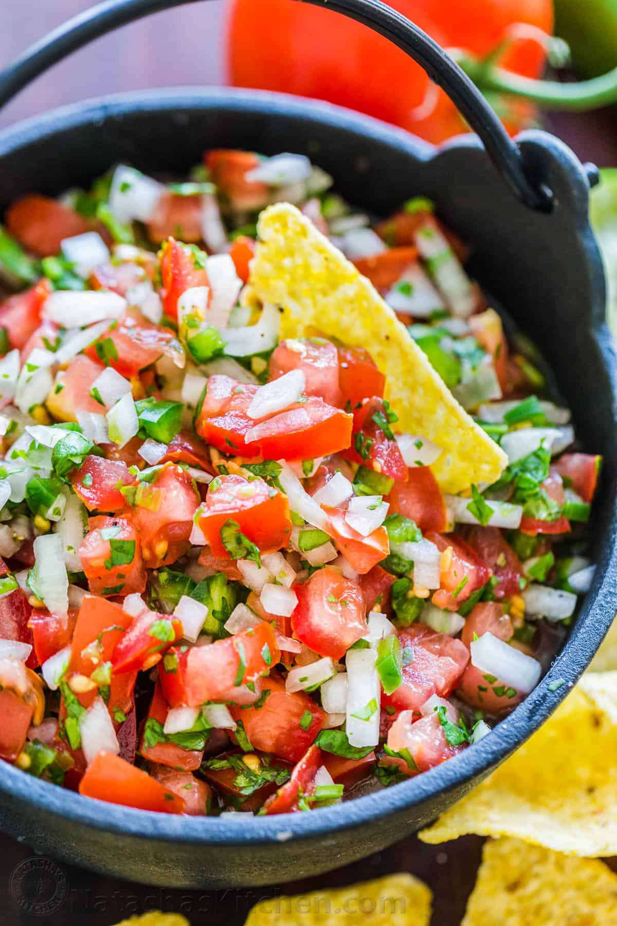 How to make the best Pico De Gallo with fresh tomatoes, onion, cilantro, jalapeno and lime juice. Learn the secret to authentic Mexican Pico De Gallo! #picodegallo #picodegallorecipe #salsa #summersalsa #mexicanpicodegallo #autheticpicodegallo #howtomakepicodegallo #natashaskitchen Pico De Gallo in a bowl served with tortilla chips
