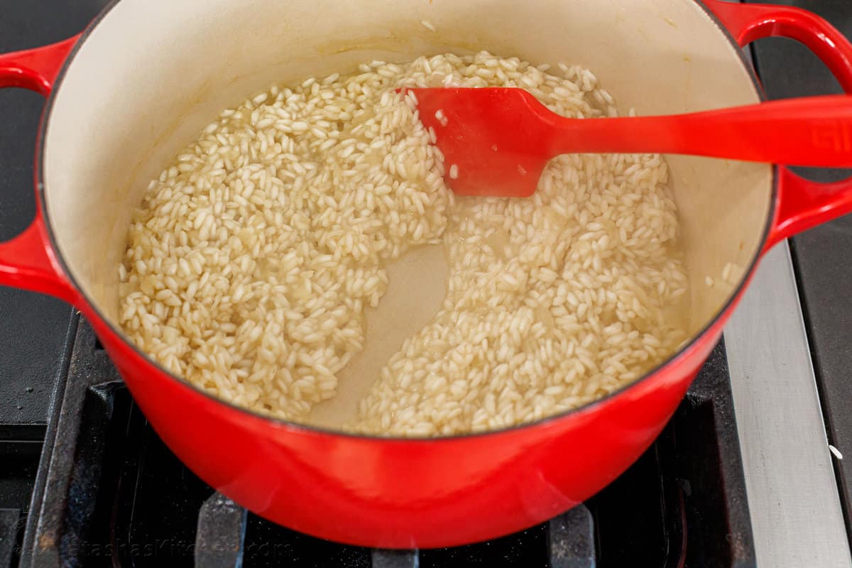 How to tell when you need to add more liquid to risotto Risotto cooking in a pot
