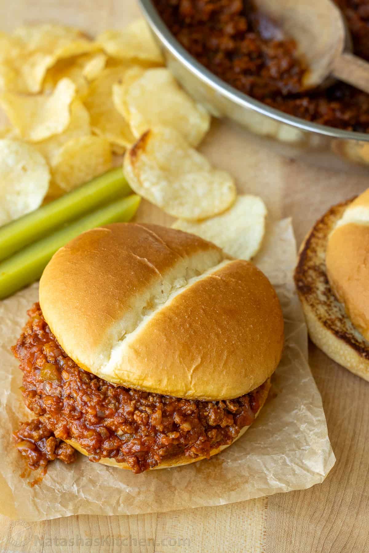 The BEST Homemade Sloppy Joe recipe with ground beef, onion, and bell pepper in tomato sauce served on toasted buns. An easy 30-minute dinner Sloppy Joe served in a toasted bun with potato chips and pickle spears