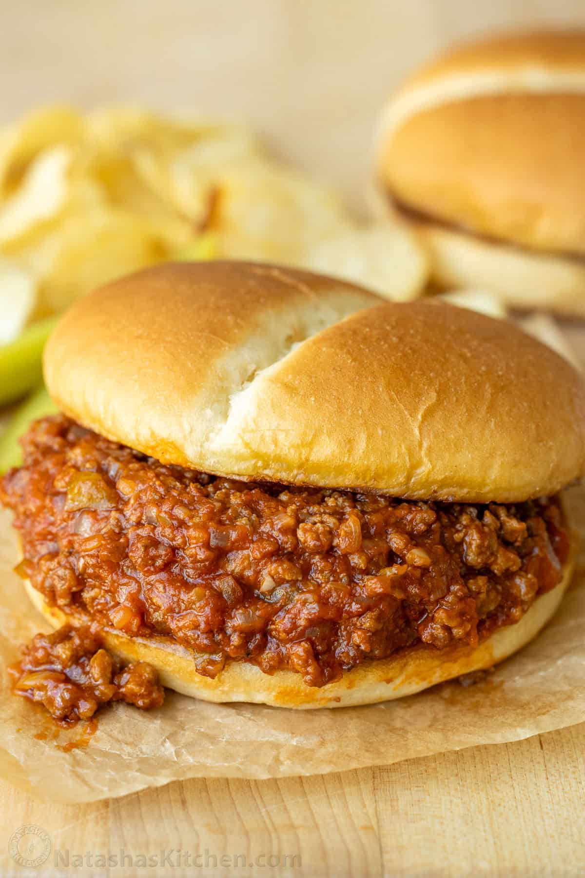 The BEST Homemade Sloppy Joe recipe with ground beef, onion, and bell pepper in tomato sauce served on toasted buns. An easy 30-minute dinner Sloppy Joes with some meat sauce spilling out of the bun