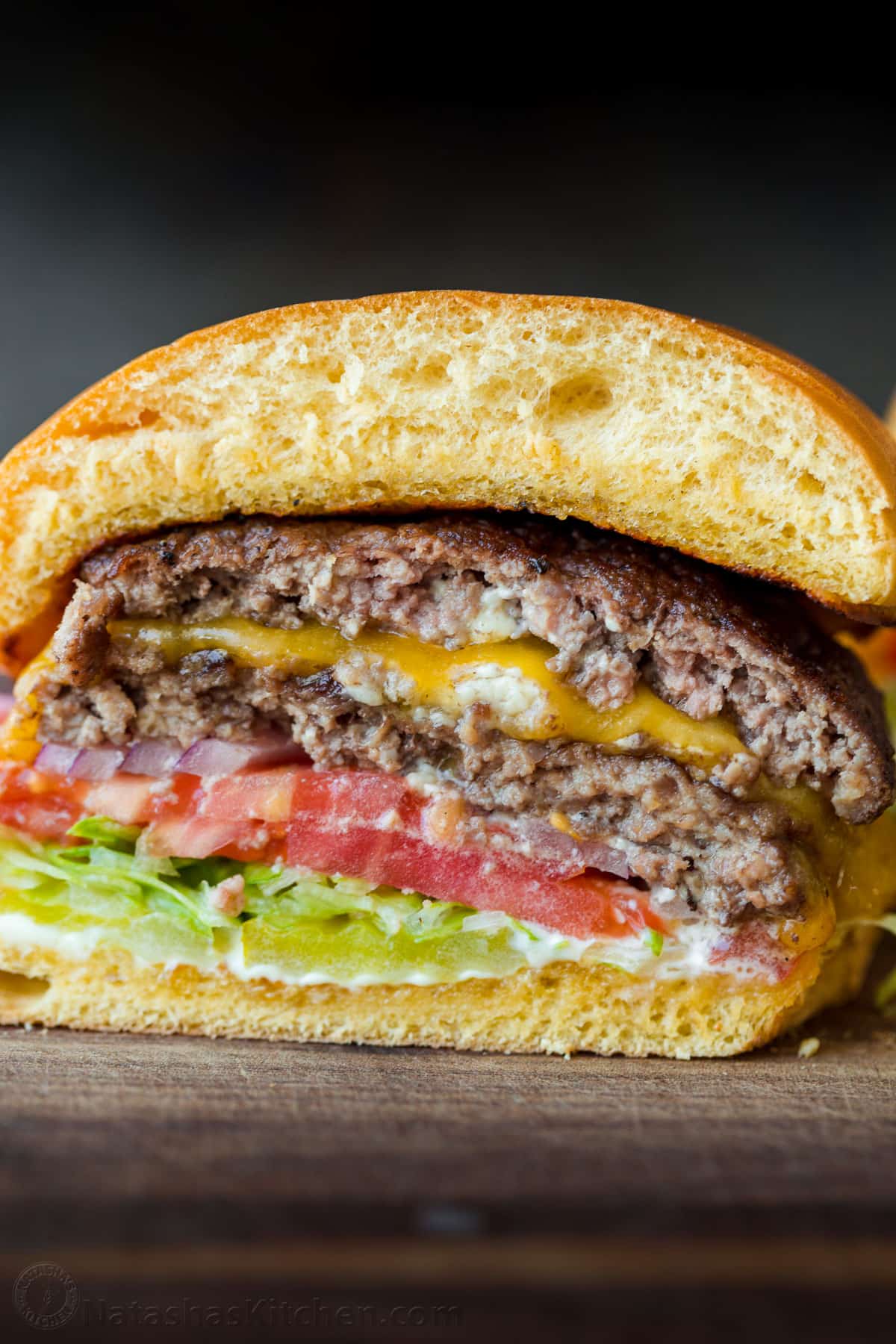 A restaurant-style Smash Burger is one of the tastiest ways to cook a burger. You’ll love the double patty with melted cheese in between. Center of a smash burger showing the layers