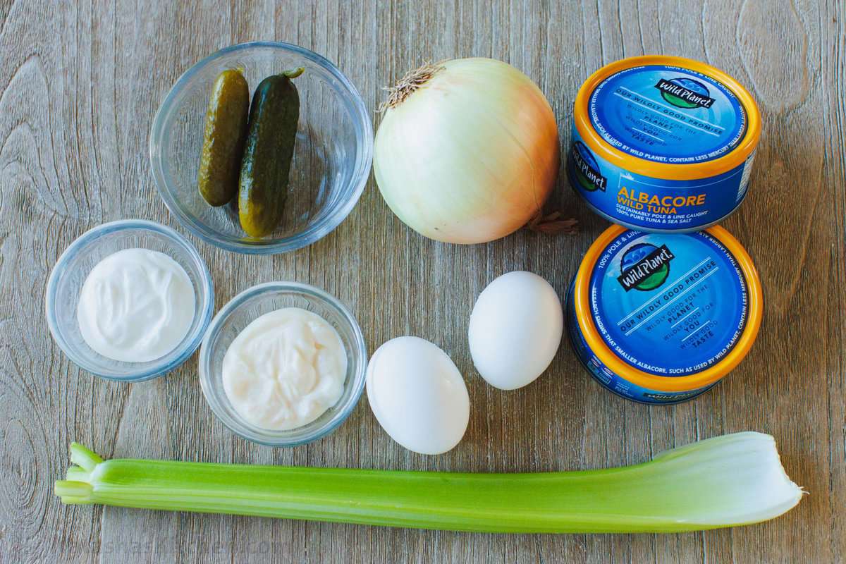 This Classic Tuna Salad recipe is light and fresh, made with tuna, celery, eggs, and the best tuna salad dressing. Great for meal prep lunch! The ingredients for the best lunch recipe including canned fish, onion, hard-boiled eggs, mayo, sour cream, pickles, celery
